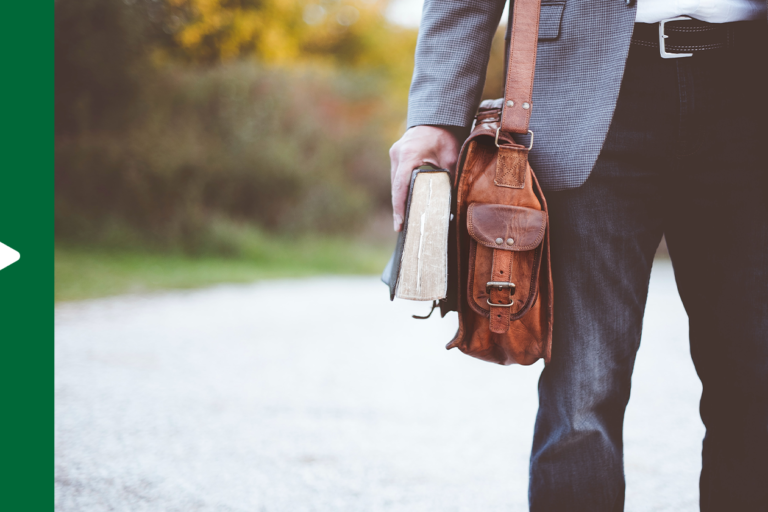 Pastor holding both a Bible and a briefcase