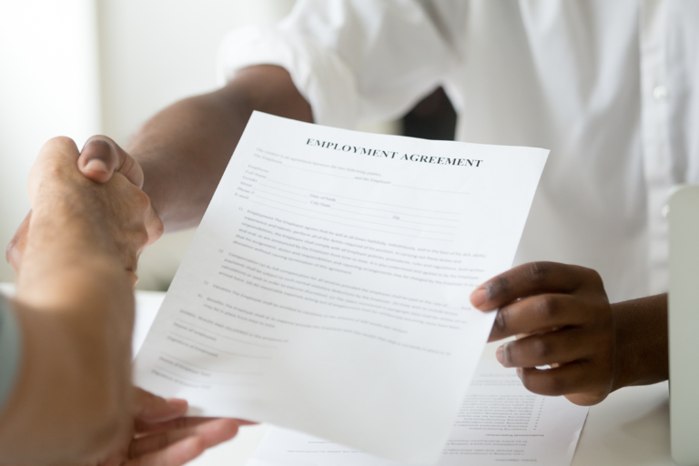 Job applicant shaking hands with interviewer